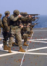 Marines assigned to Commander, Seventh Fleet, Fleet Anti-terrorism Security Team (FAST), Third Platoon, familiarize themselves with the M500 shotgun