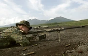  scout sniper firing downrange with an M82A3