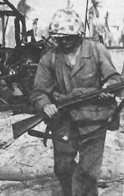 United States Marine carrying a Winchester M97 shotgun during 