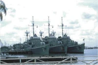 RVNS Trần Quốc Toản (HQ-06) pierside at center, with her sister ships  (left) and  (right).