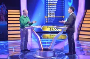 William plays the game with Host Chris Harrison.
