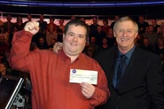Gibson with host Chris Tarrant and his cheque.