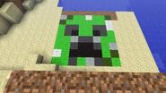 A creeper face created out of wool in the ground.