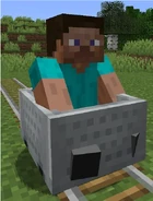 Steve riding a Minecart.