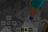 A player standing on some coal ore.