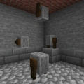 Grindstones on a wall, floor, and ceiling.