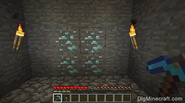 Player holding an enchanted diamond pickaxe.