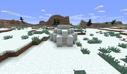 Um iglu com um bioma de Colinas de Gelo por trás dele.