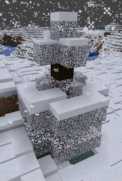 Eine Fichte während Schneefalls in der Bedrock Edition.