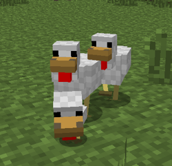 Un pollito con sus padres.