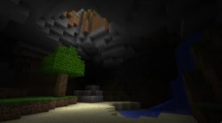 Un árbol que fue naturalmente generado en una cueva, con luz proveniente de un agujero en el techo.