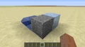 An example of the unnaturally bulging hitbox on a block of redstone ore in 13w38a-13w41a.