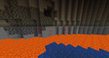 Multiple natural blobs of redstone in to the cave.