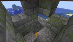 An underwater ruin in Java Edition that generated on land with a visible loot chest that is not waterlogged and doesn't have water on top of it.