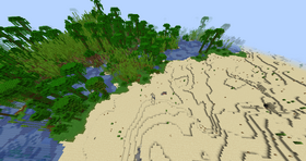 A desert with a jungle right beside it.