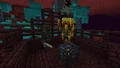 A wither skeleton and two blazes near a blaze monster spawner.