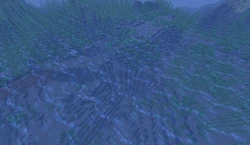 A ravine, shipwreck, ruin, and dolphins beneath the surface of an ocean.