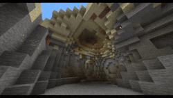 A large amount of sand floating above a cave and being broken.