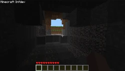 A small cave illuminated by sunlight.