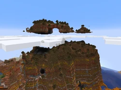 A floating island above a badlands mountain.