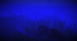 A shipwreck and ravine at the bottom of an ocean.