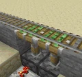 An example of sticky piston use with rails.