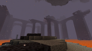 A nether fortress bridging over a basalt deltas biome.