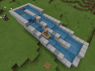 Endlessly circling moat showing a boat floating uphill using only water flow power