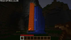 A lava and water fall that have generated next to each other (screenshot was taken with a texture pack enabled).