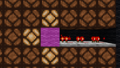 Demonstrating how a solid block powers redstone lamps.