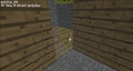 Hidden sponge in the corner of a wood-paneled room, in Minecraft Classic.