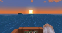 Ocean ruins and a small island visible at sunset.