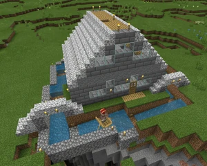 At the back of the house, the moat overhangs a canyon