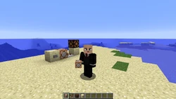 Searge holding a command block in front of a command block.