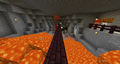 A zombie being pushed by a snowball in the lava bridge.