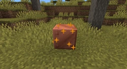 Applying wax to a copper block.