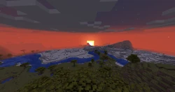 A sunset over desert and savanna biomes.