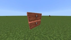 Two large copper chests stacked on top of one another.