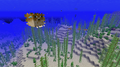 A fully inflated pufferfish, with six deflated pufferfish and a school of cod behind it.