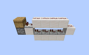 An example of a 1-block wide setup that will activate a dispenser once a beehive is ready for collection.