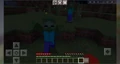 Zombies attacking in Bedrock Edition or in Pocket Edition.