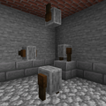 Grindstones on a wall, floor and ceiling.