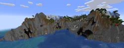 A large bay surrounded by tall stone cliffs.