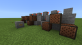 Redstone linked to note blocks, playing a simple melody when the button is pressed.