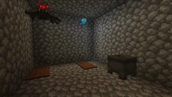 Inside of a jail cell, the only notable features being the carpet "bed" and a cauldron in the corner.