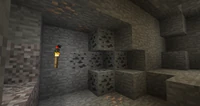 Als een stuk grind wordt verwijderd kan het waardevolle (?) items onthullen, zoals kolen en ijzer.