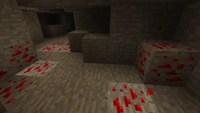 Verschillende Redstone-ertsaders in een grot