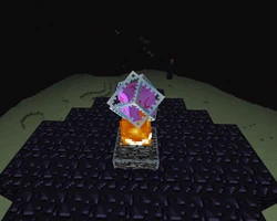 Een Endkristal op een obsidianen pilaar.