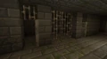 Возможно, тюремные камеры, с открытыми железными дверьми.