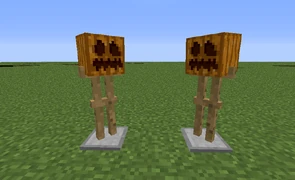 Гарбузи надіті на стійки.